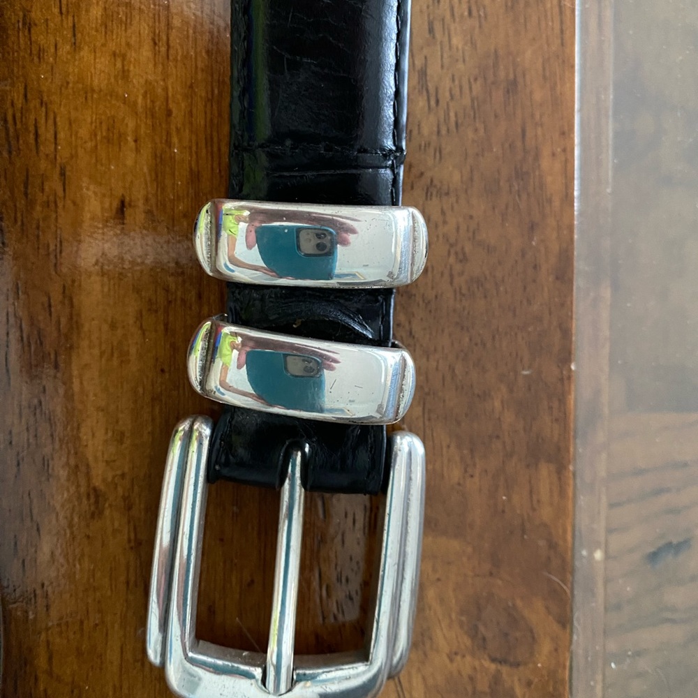 Men’s size 32 Leather Belt with silver accents.